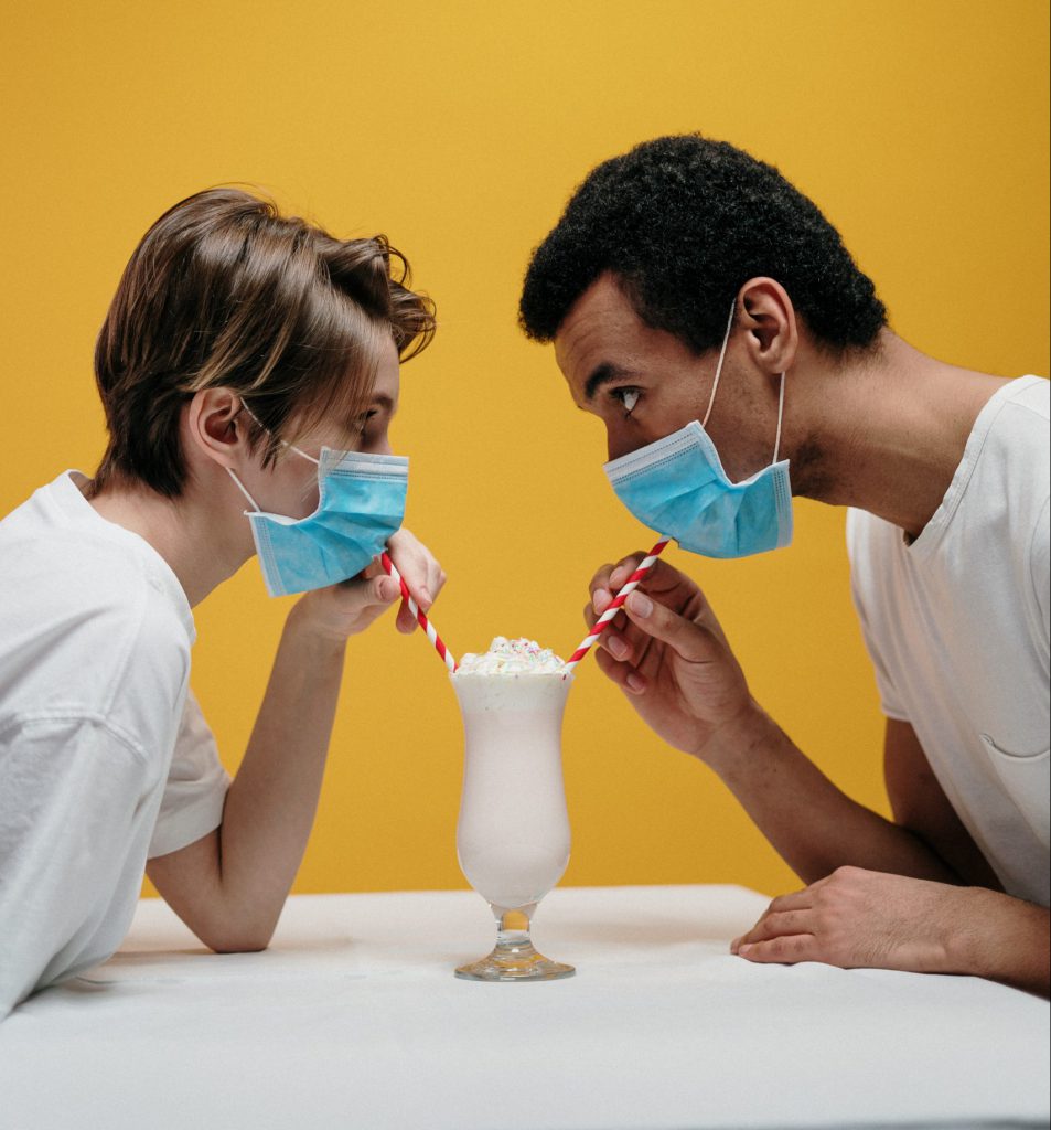 Couple wearing masks on a date